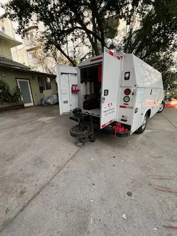 Magnet Plumbing service vehicle on-site for Grease Trap Cleaning in Mission Grove
